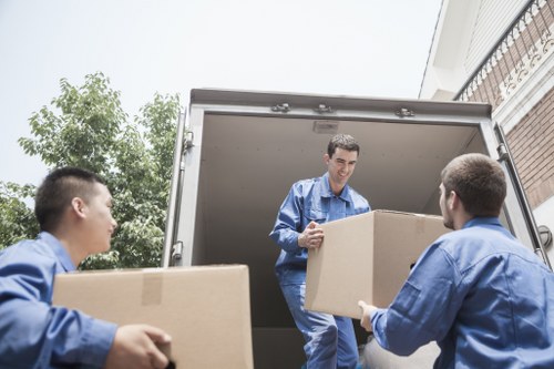 Man with van assisting a move in a Mayfair street