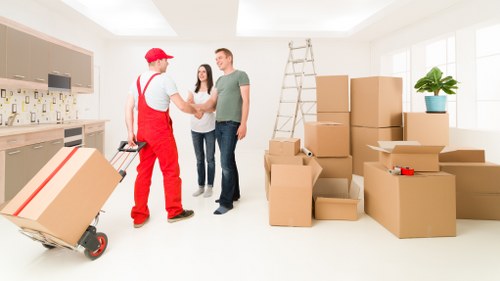 Supervisor overseeing safe moving practices during a van job