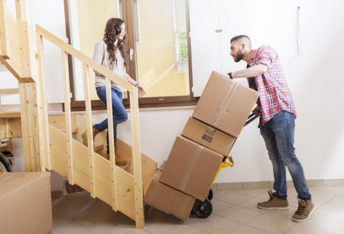 Packed furniture and boxes being loaded for removal truck hire in Mayfair