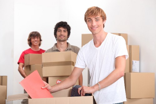 Careful unpacking of boxes in a Mayfair apartment